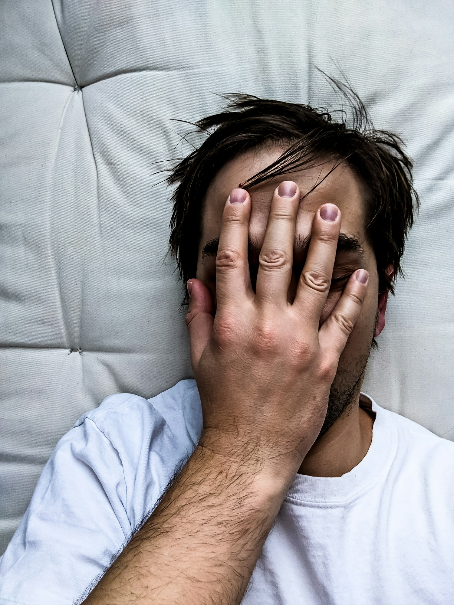 Exhausted Young Man on Bed - Frustrated Man