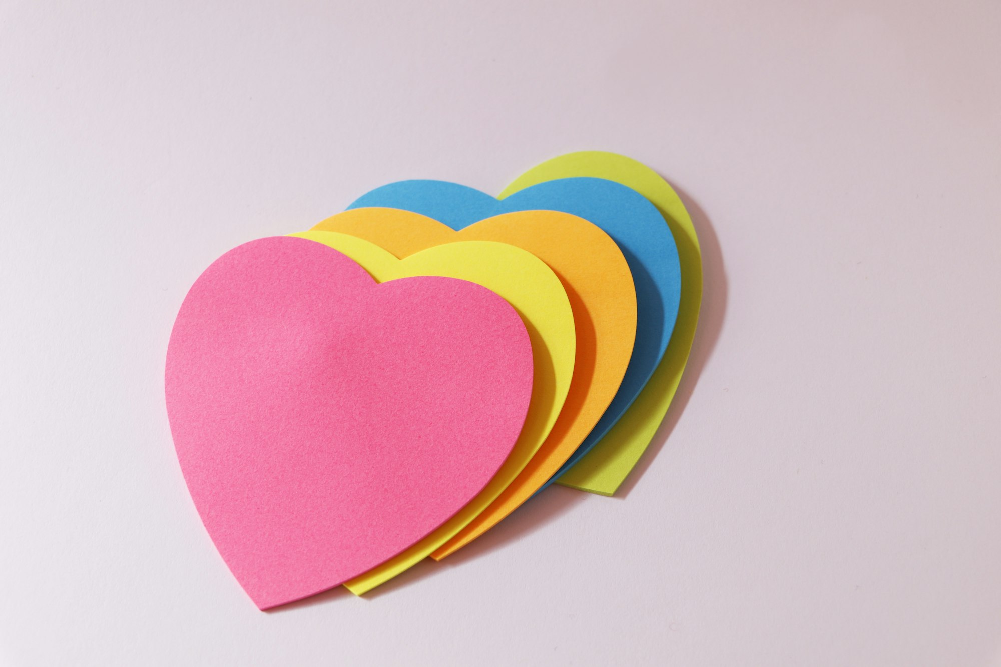 Heart-shaped paper stickers on the tabl