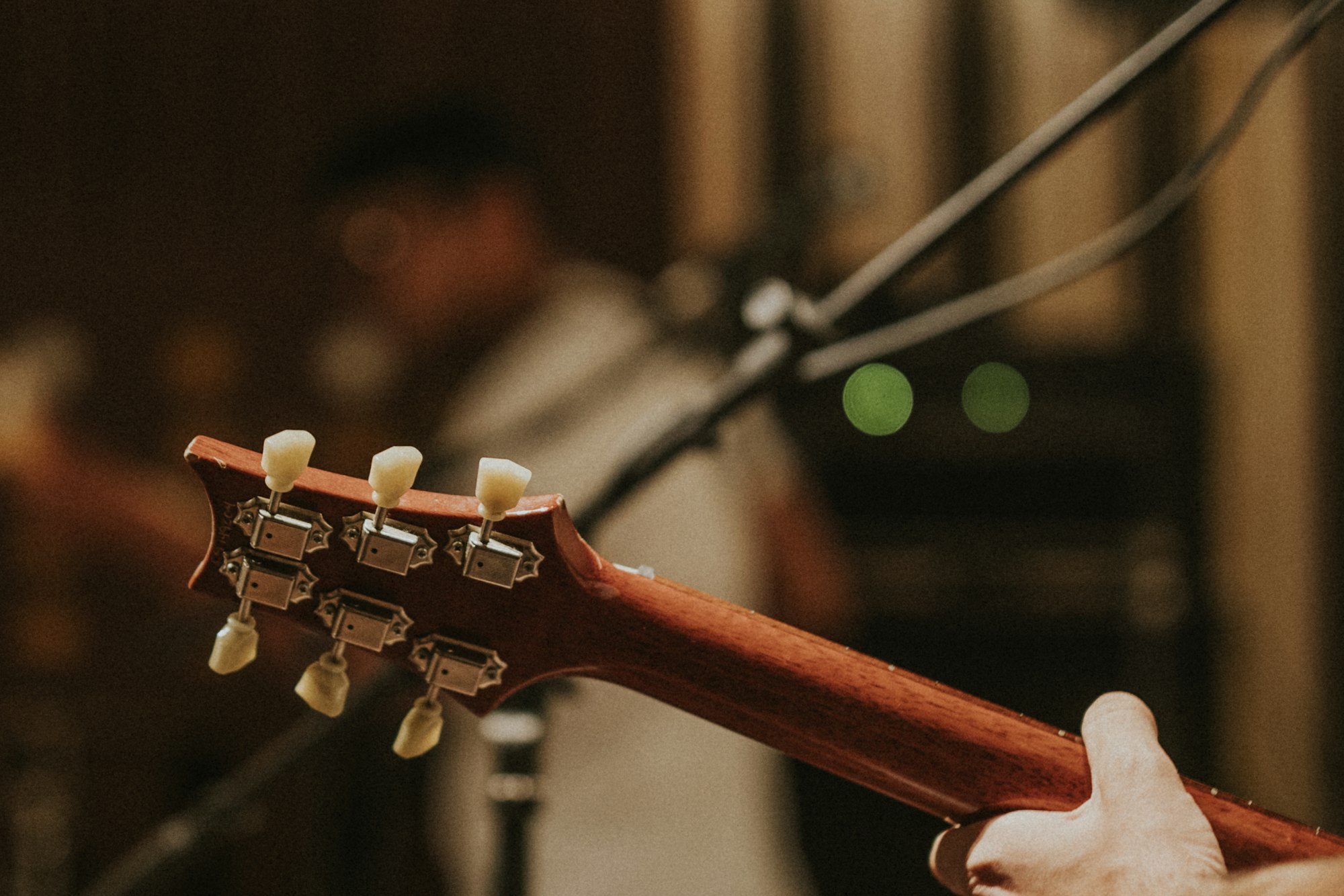 Musician playing guitar background, aesthetic photography